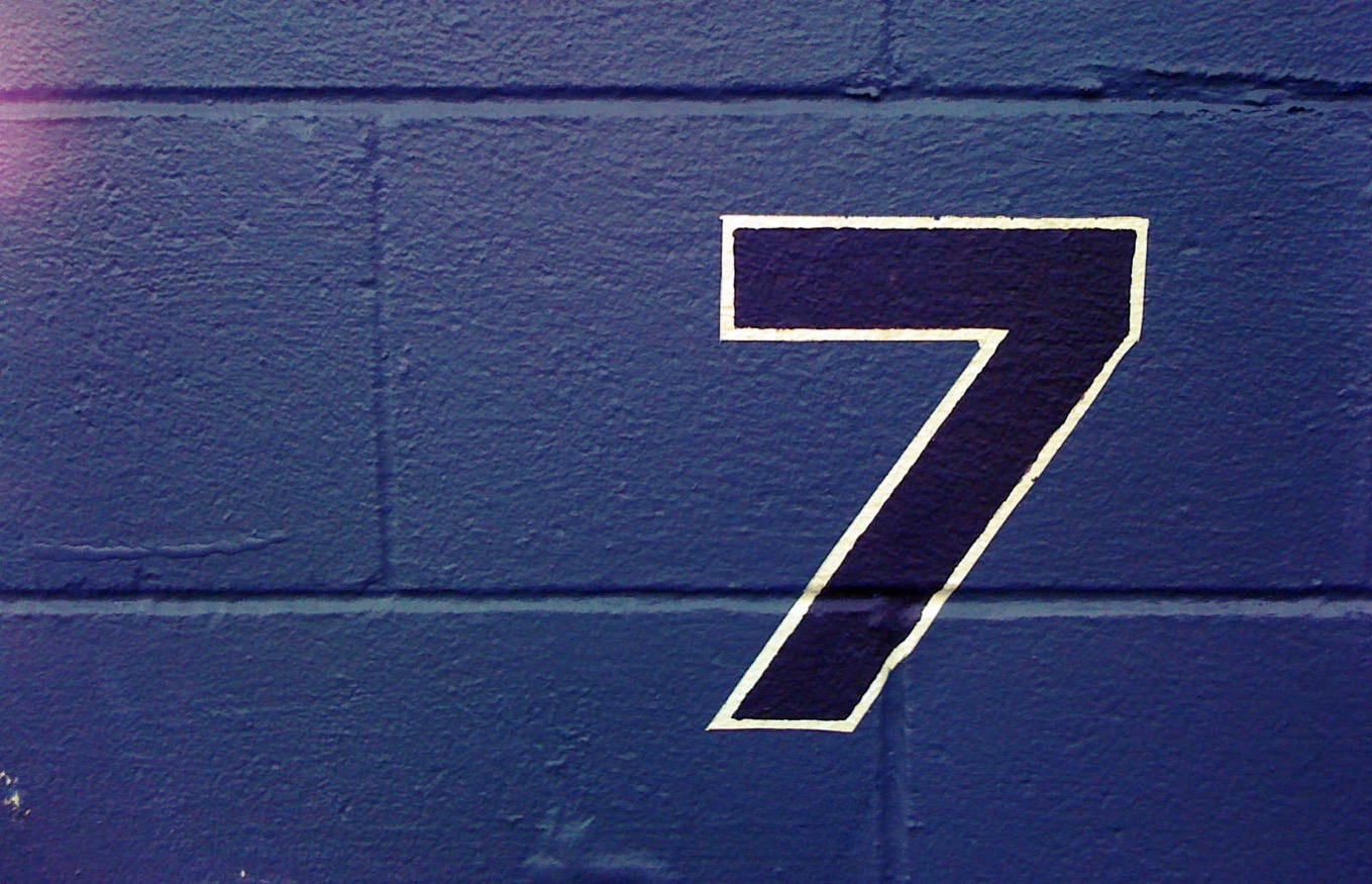 Seven on blue wall