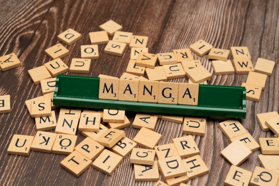 Free photo of the word manga is spelled out with scrabble tiles